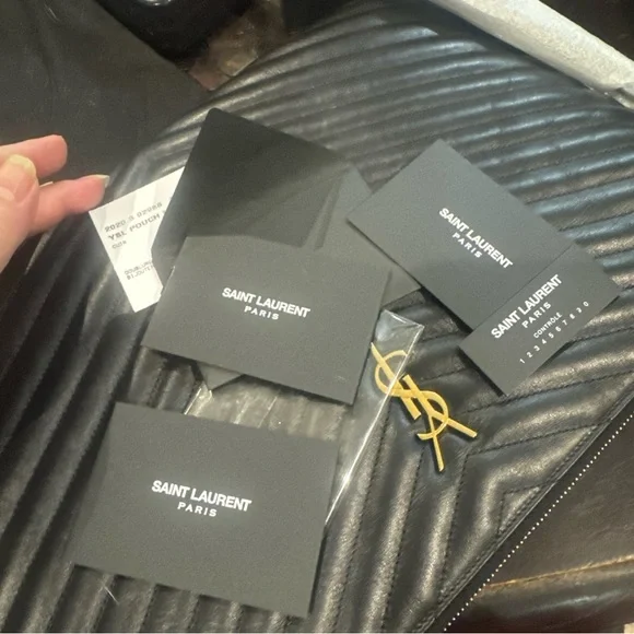 Yves Saint Laurent Black Sizable Clutch with detachable wristlet with gold YSL. - Picture 16 of 16